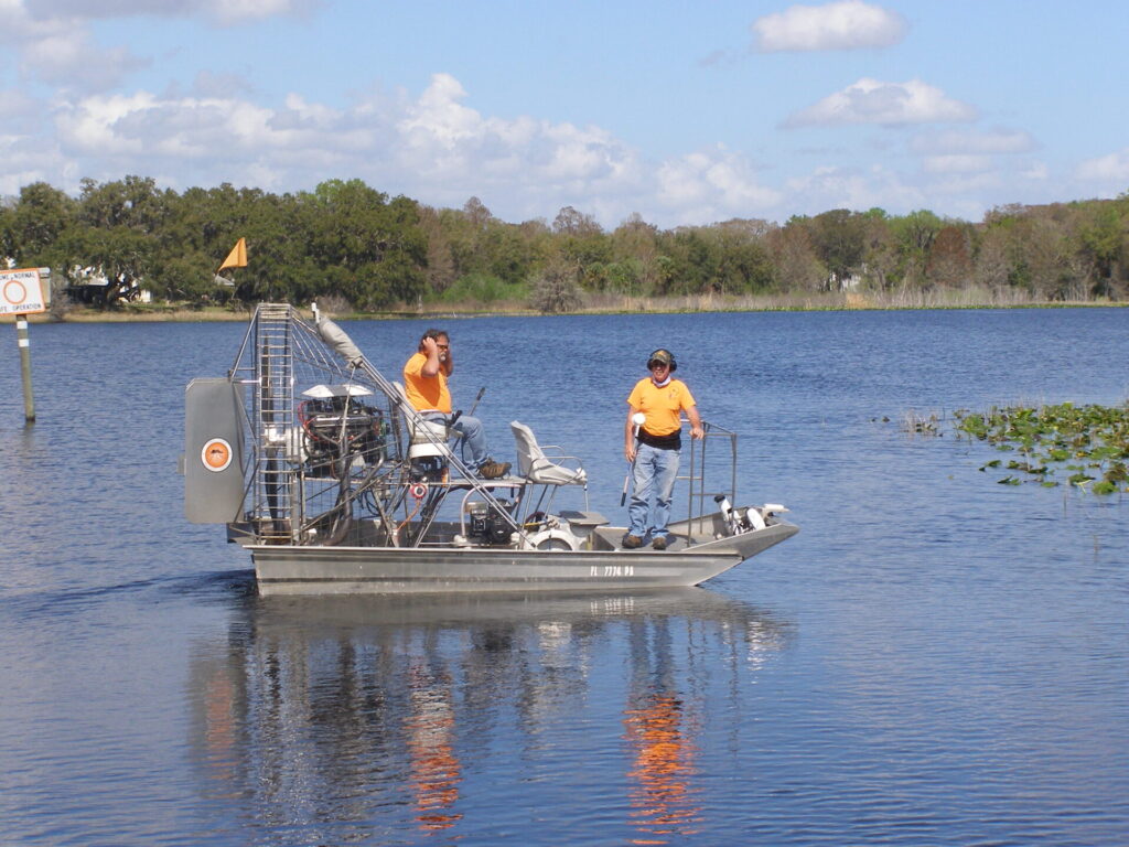 Employees on airboat