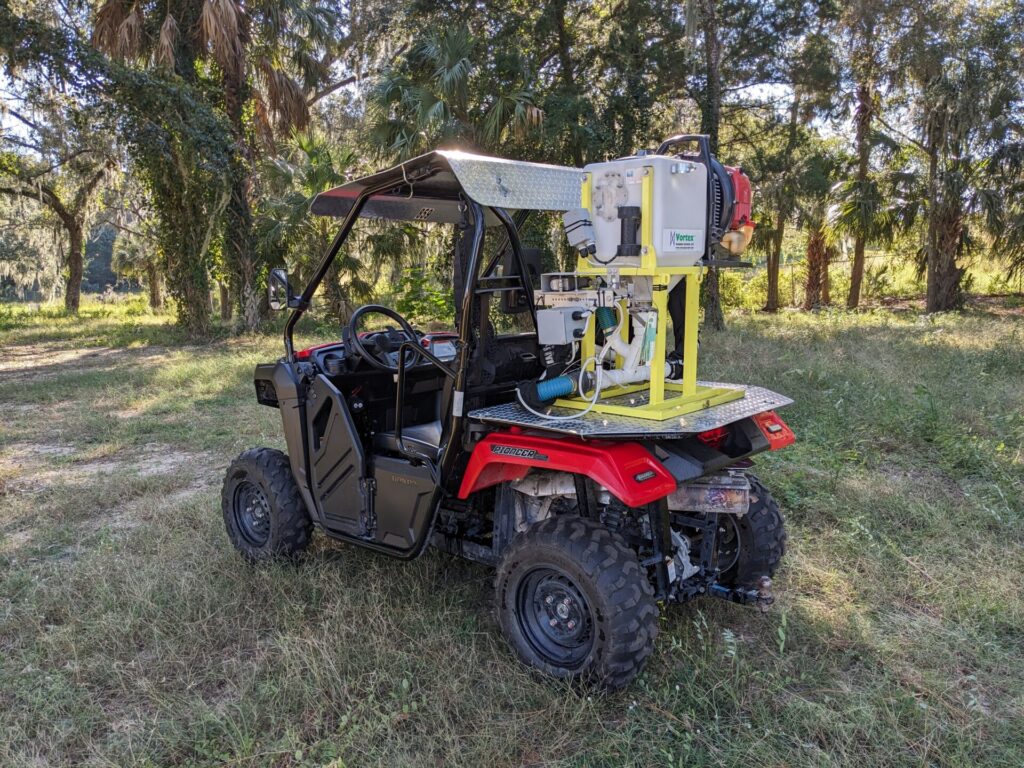 UTV with larviciding spreader