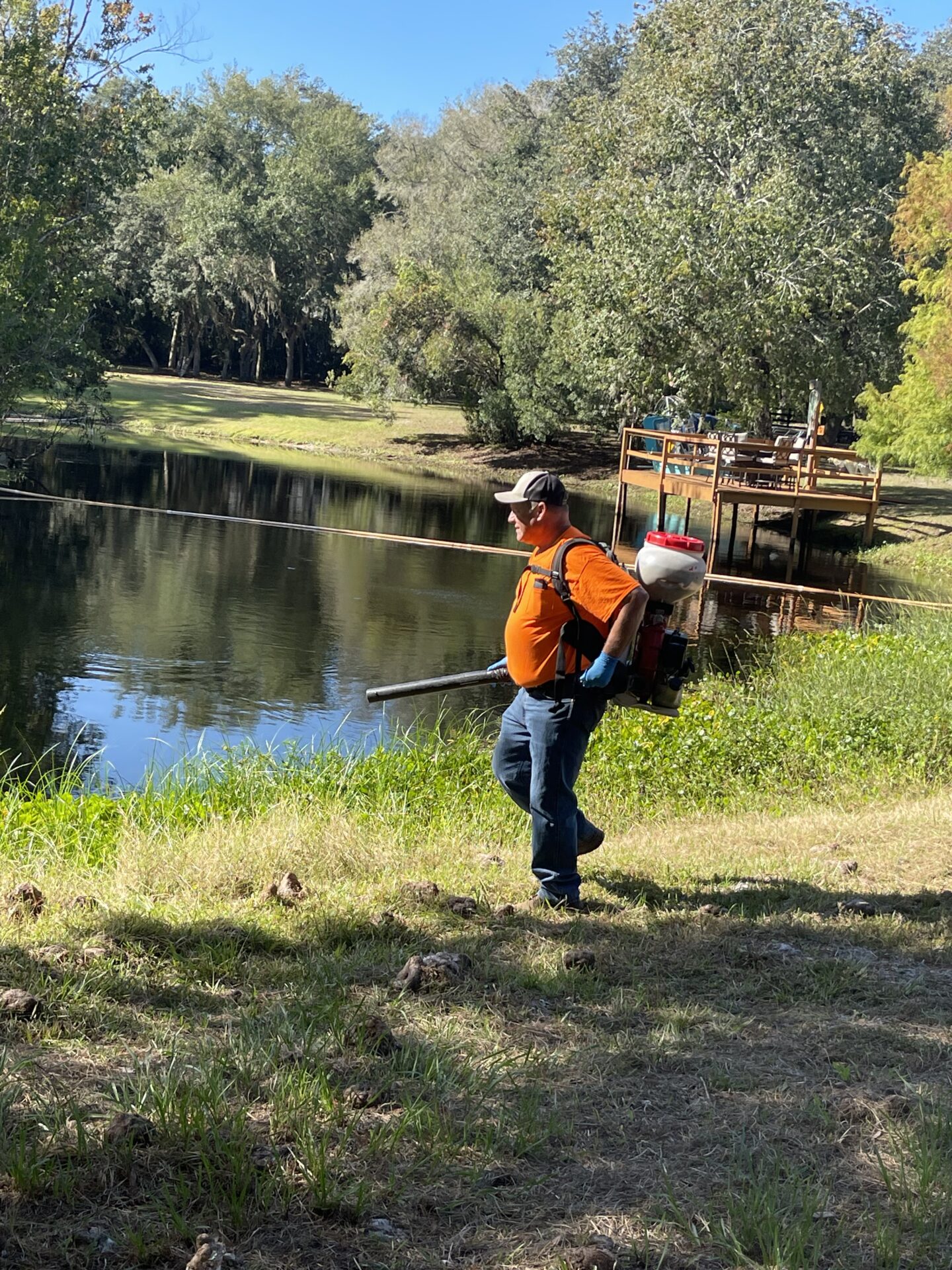 employee applying mosquito control product